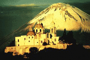 The Beautiful Cathedral atop the pyramid in Cholula w/ Mt. Popocatepetl in background.